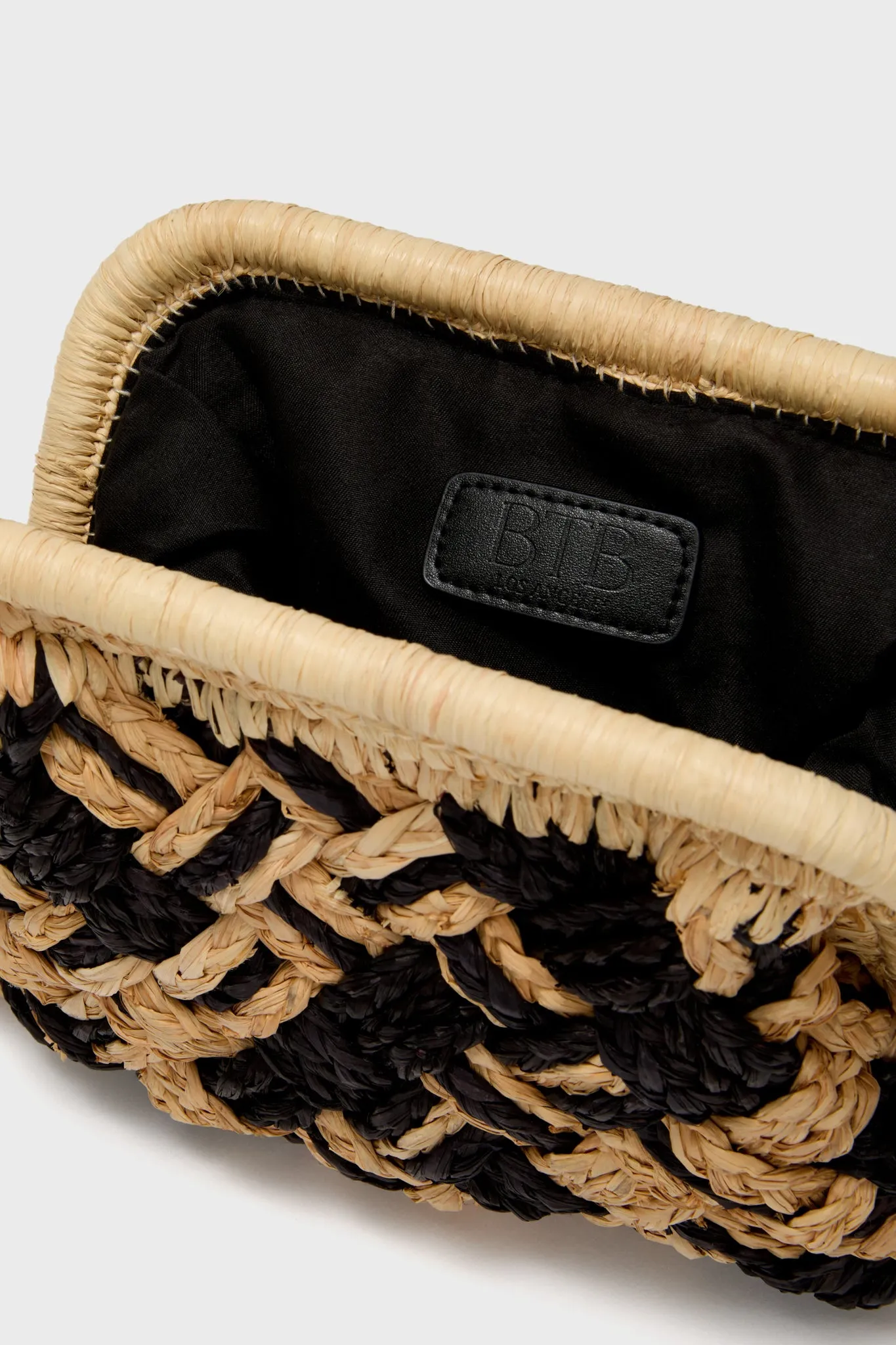 Black and Natural Cyrus Clutch