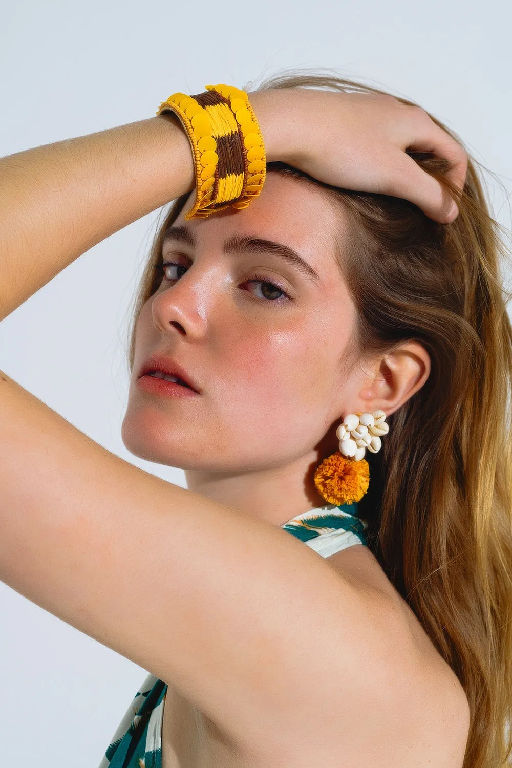 Earrings With Cream Seashells and Yellow Pom Poms