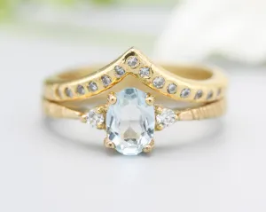 Set of 2 Oval Blue topaz ring and diamond side set in prongs setting with 14k gold band set with 14k gold band ring and tiny 15 diamond
