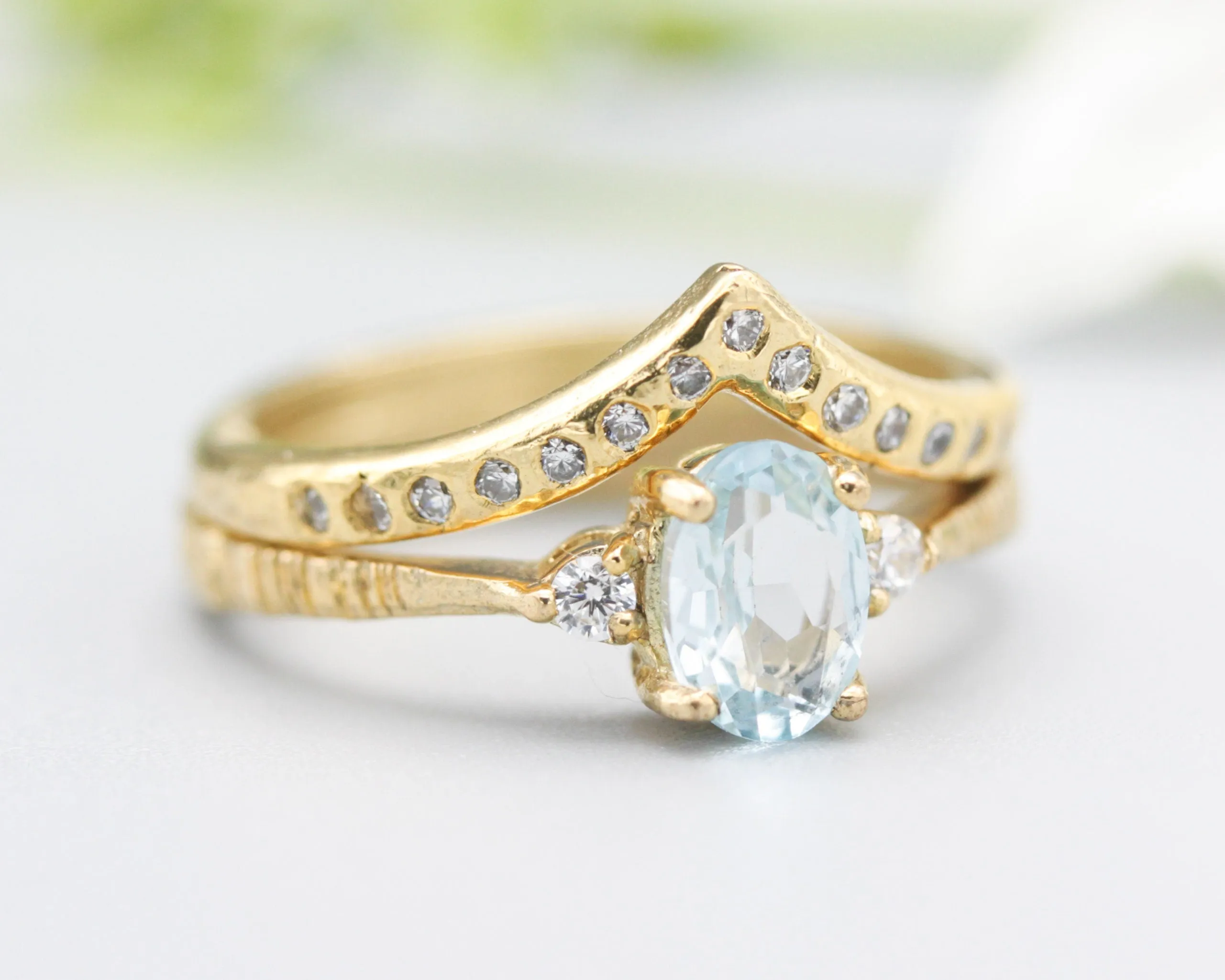 Set of 2 Oval Blue topaz ring and diamond side set in prongs setting with 14k gold band set with 14k gold band ring and tiny 15 diamond