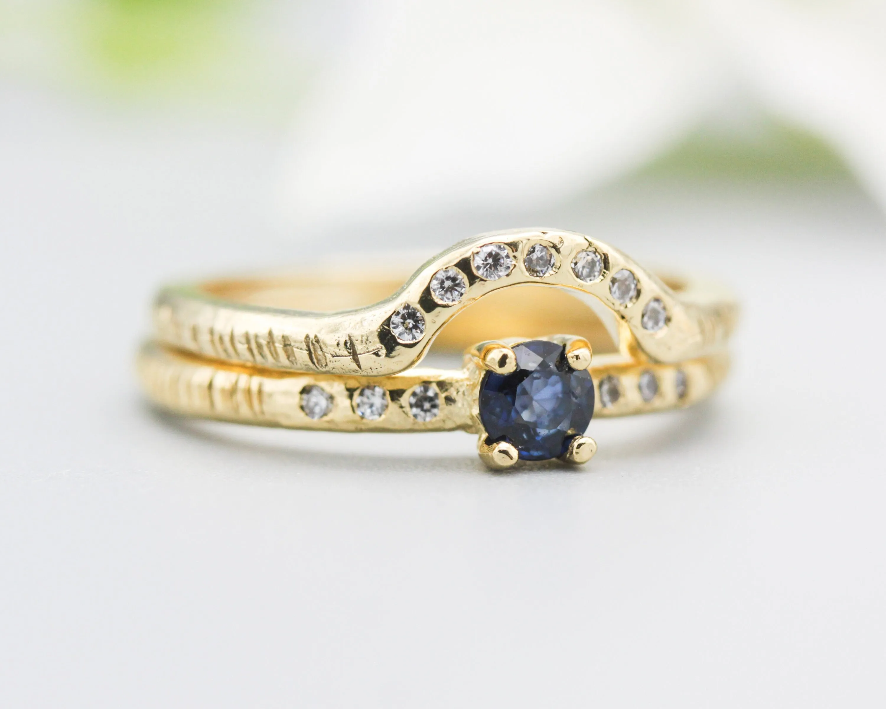 Set of 2 Round faceted blue sapphire ring with tiny diamonds on 14k gold band set with 14k gold band ring with tiny 7 diamond on the center