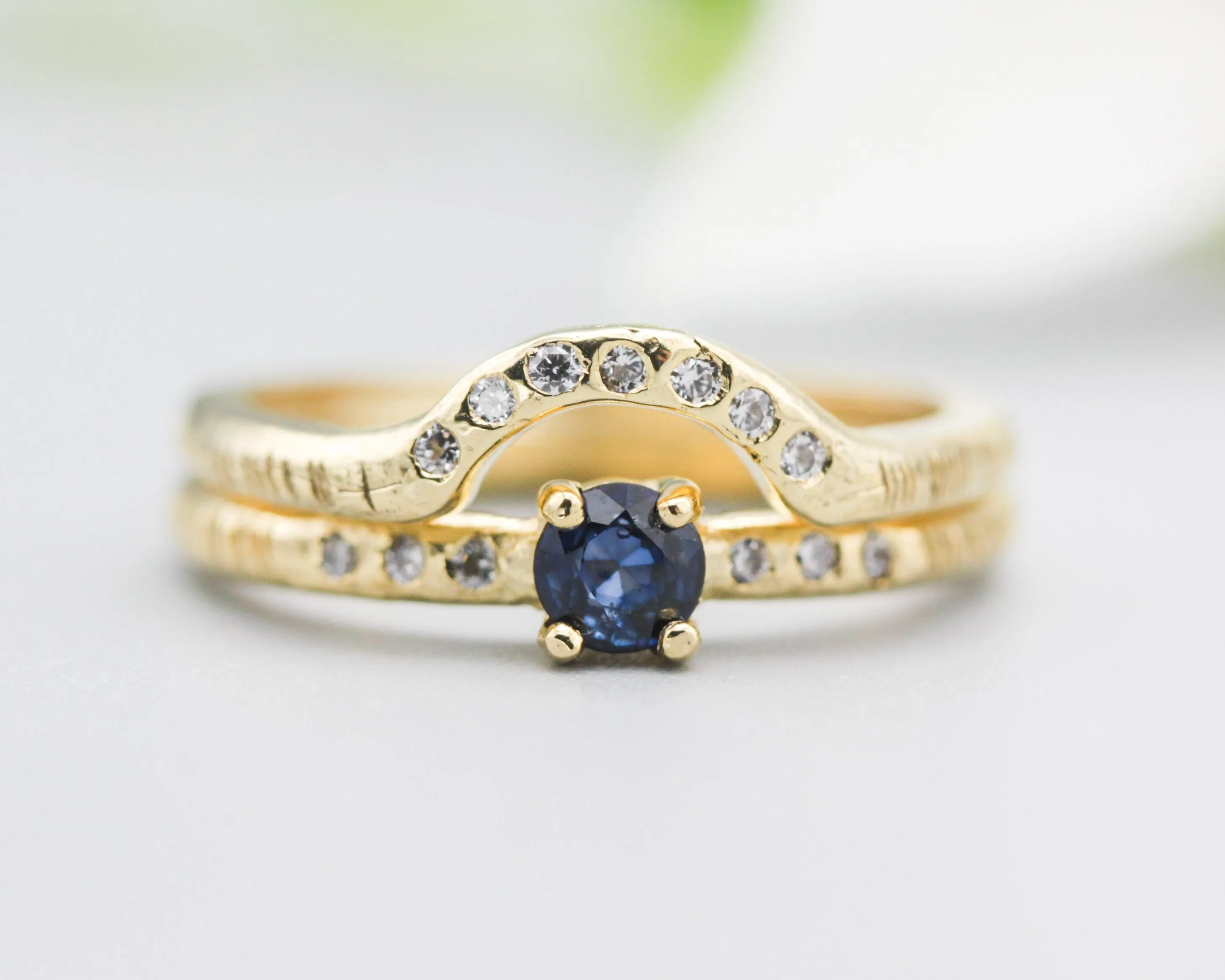 Set of 2 Round faceted blue sapphire ring with tiny diamonds on 14k gold band set with 14k gold band ring with tiny 7 diamond on the center