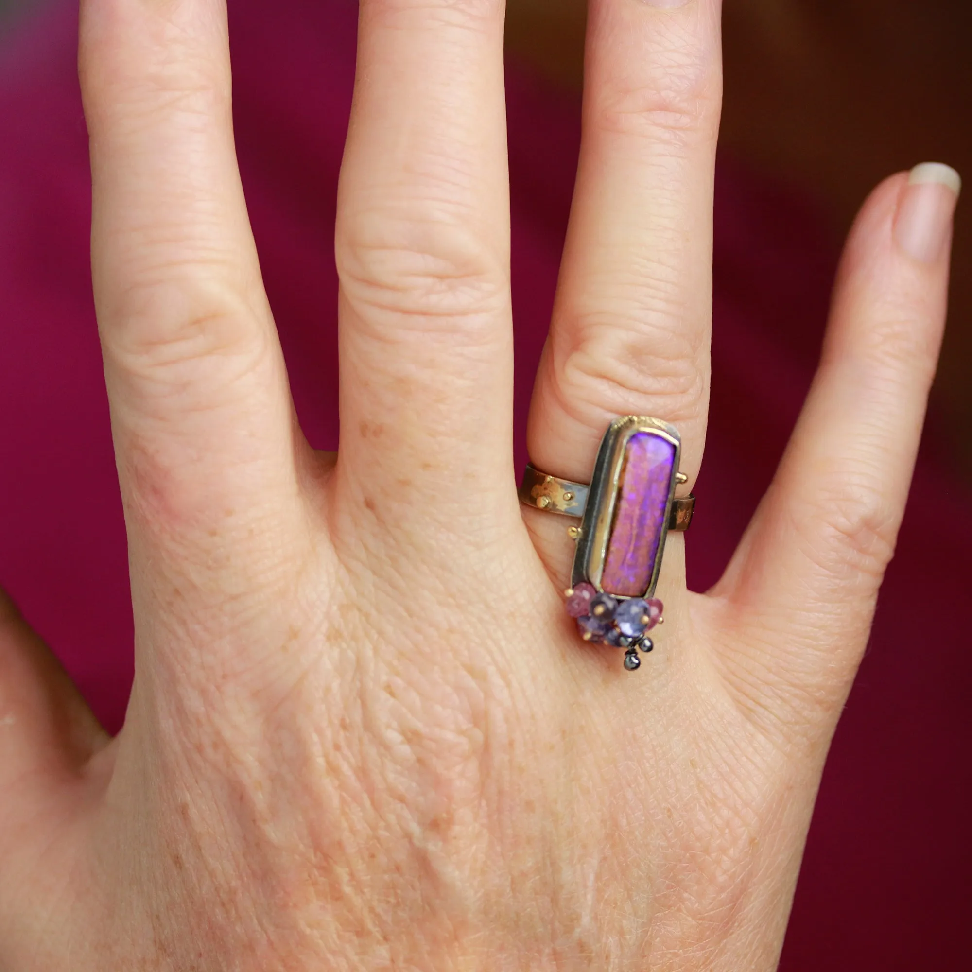 Sold. Australian Pipe Wood Fossil Opal with Ruby and Tanzanite Cluster Ring