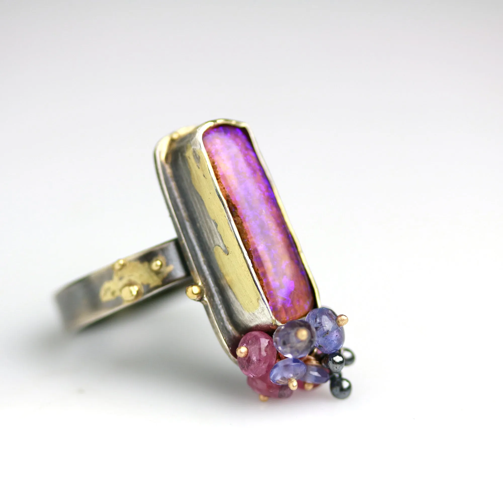 Sold. Australian Pipe Wood Fossil Opal with Ruby and Tanzanite Cluster Ring