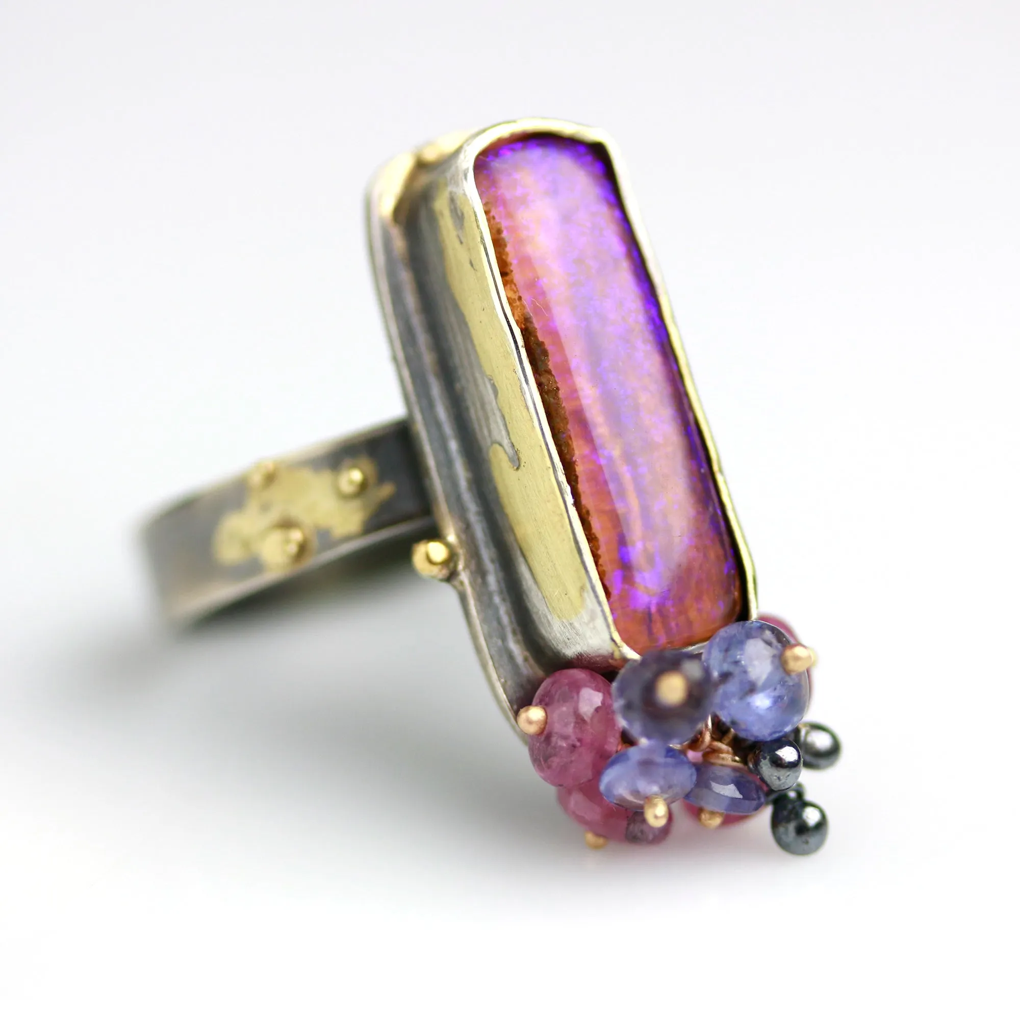 Sold. Australian Pipe Wood Fossil Opal with Ruby and Tanzanite Cluster Ring