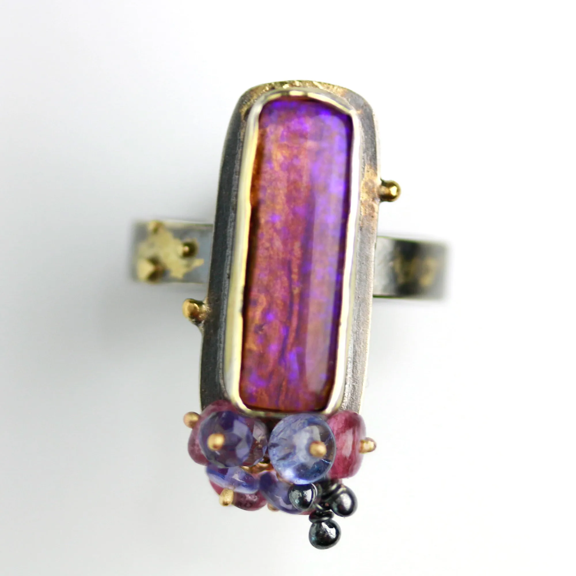 Sold. Australian Pipe Wood Fossil Opal with Ruby and Tanzanite Cluster Ring