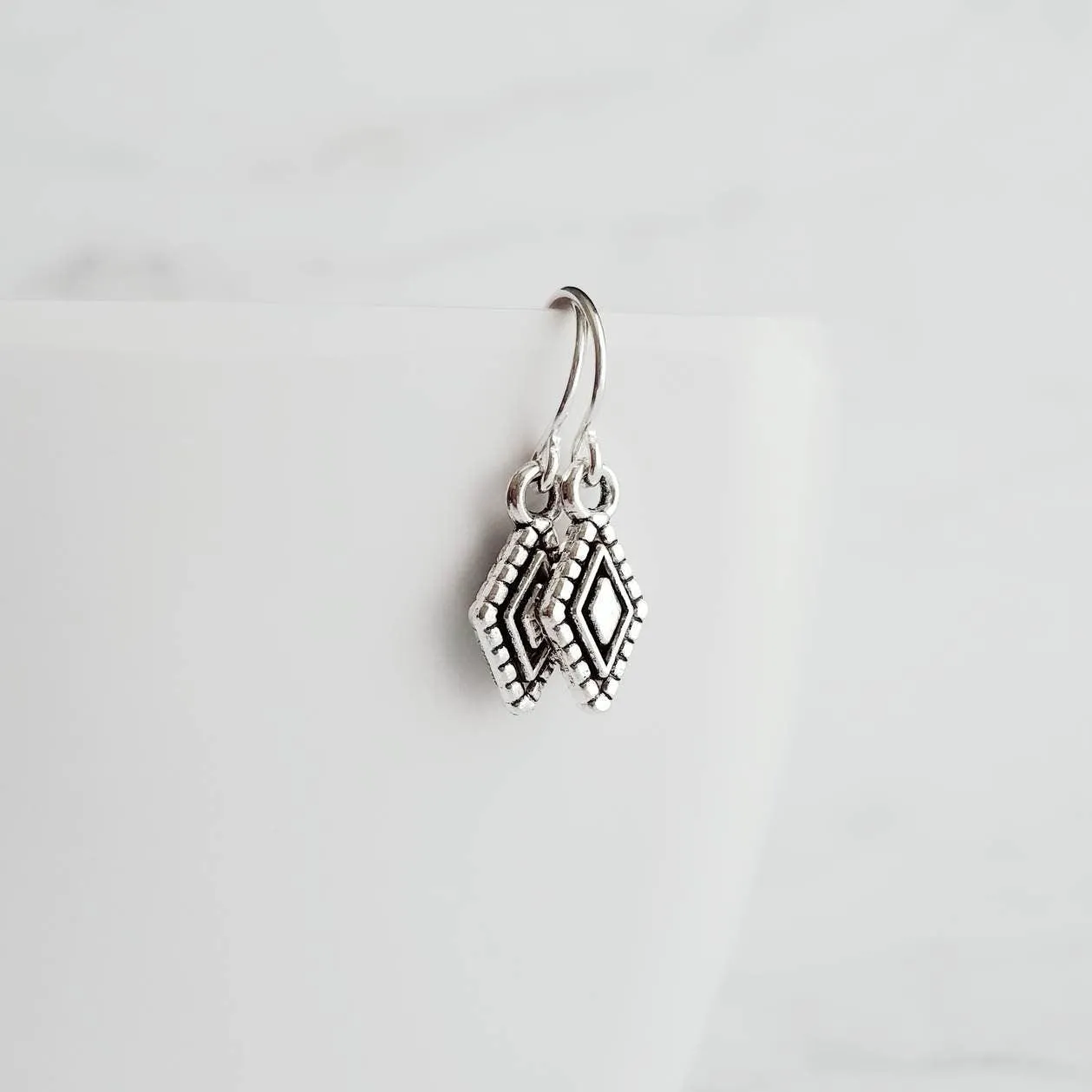 Tiny Silver Diamond Shape Earrings on small simple hooks - raised design oxidized/antique finish rhombus charm - math geometric shape
