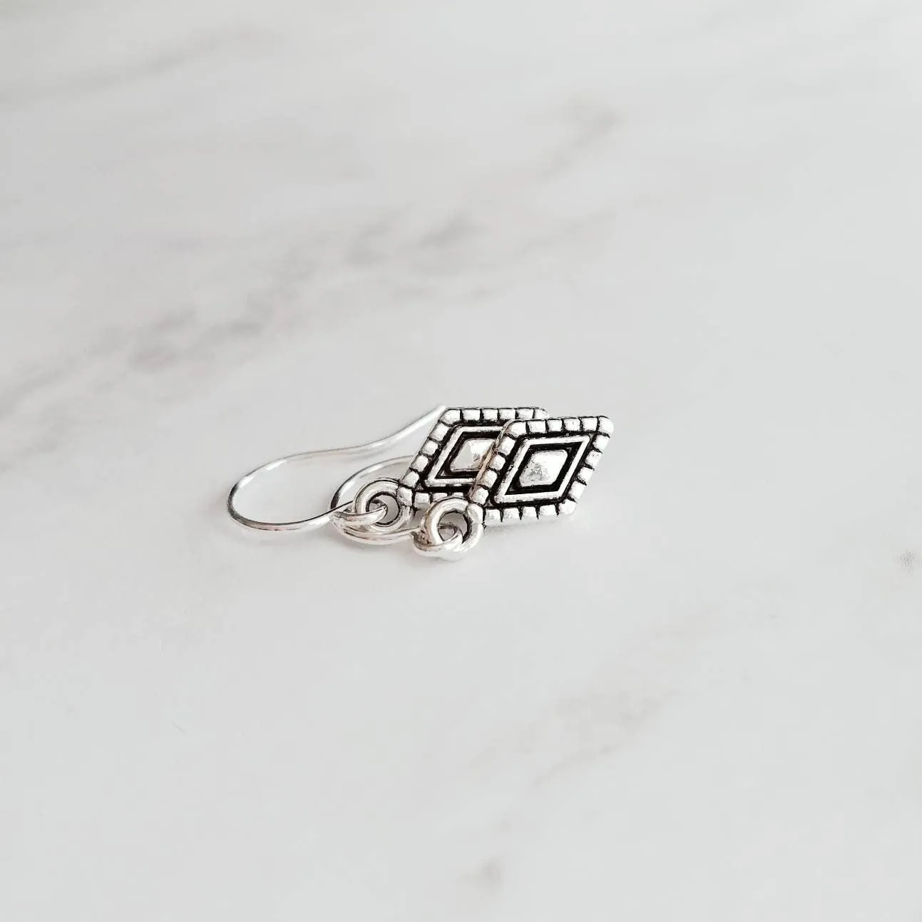 Tiny Silver Diamond Shape Earrings on small simple hooks - raised design oxidized/antique finish rhombus charm - math geometric shape