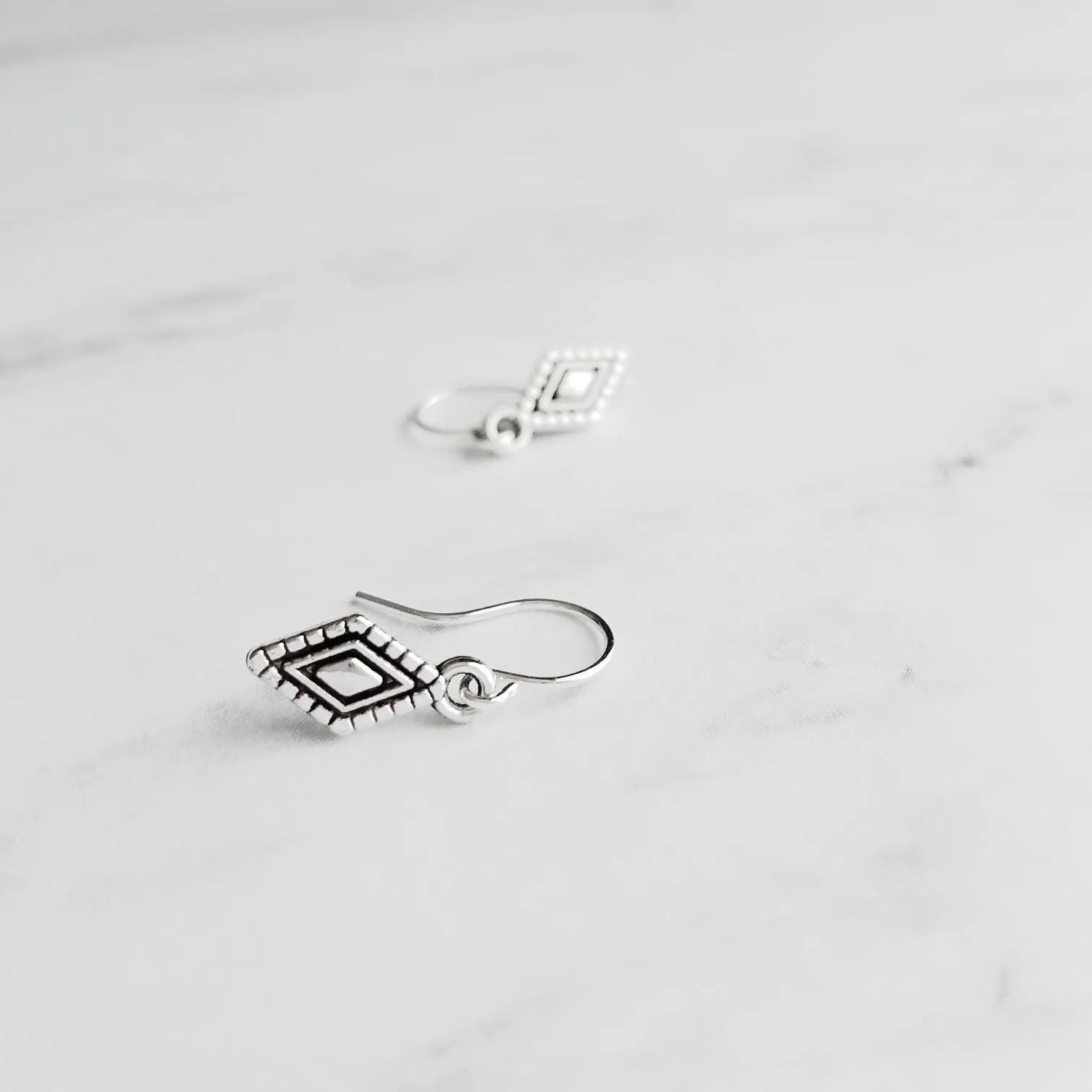 Tiny Silver Diamond Shape Earrings on small simple hooks - raised design oxidized/antique finish rhombus charm - math geometric shape