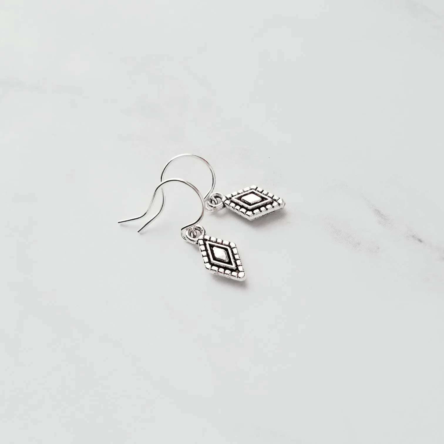 Tiny Silver Diamond Shape Earrings on small simple hooks - raised design oxidized/antique finish rhombus charm - math geometric shape